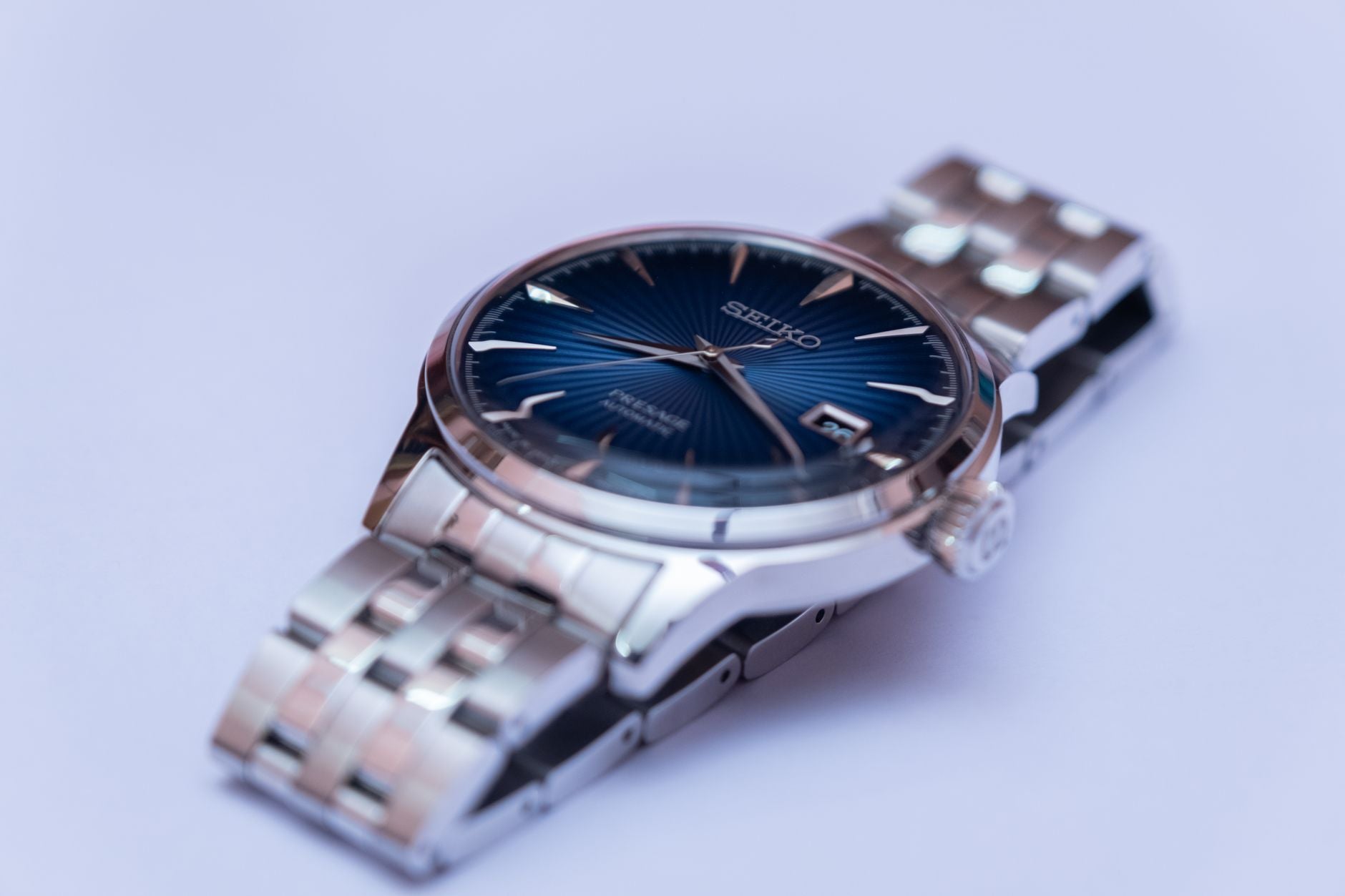 Detailed shot of a Seiko wristwatch with a metallic band, perfect for timepiece enthusiasts and accessory lovers.
