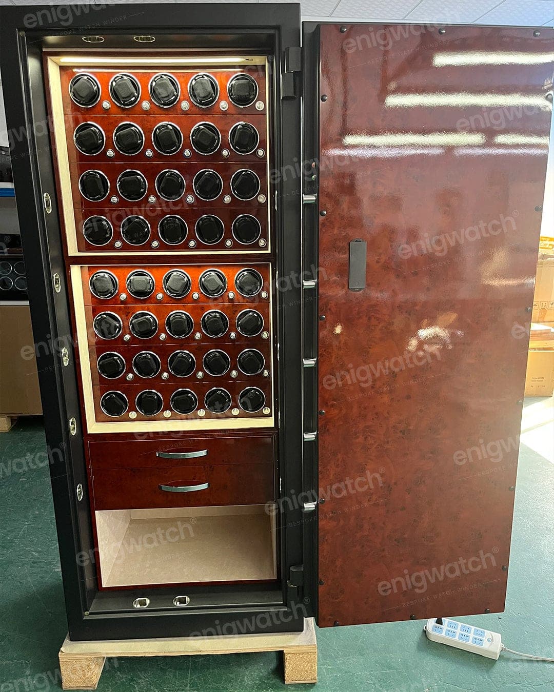 A red-burl cabinet of winder positions above a drawer bank