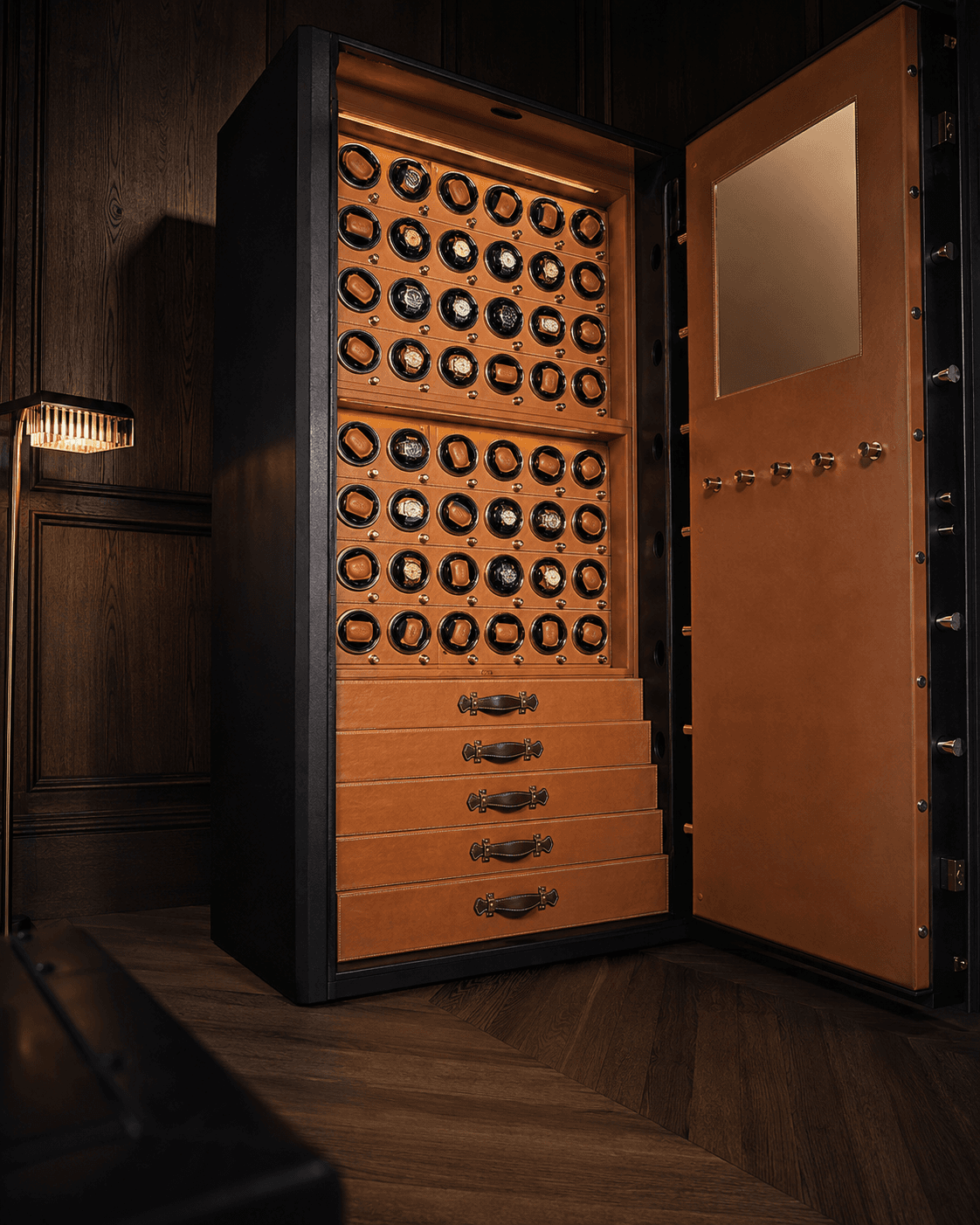 A tall cabinet carrying a full grid of winder positions over drawers, doors open