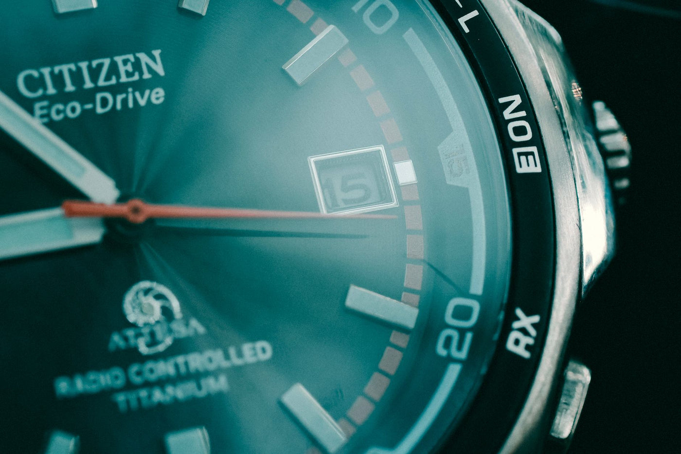 Macro shot of a Citizen Eco-Drive watch showcasing dial details and date feature.