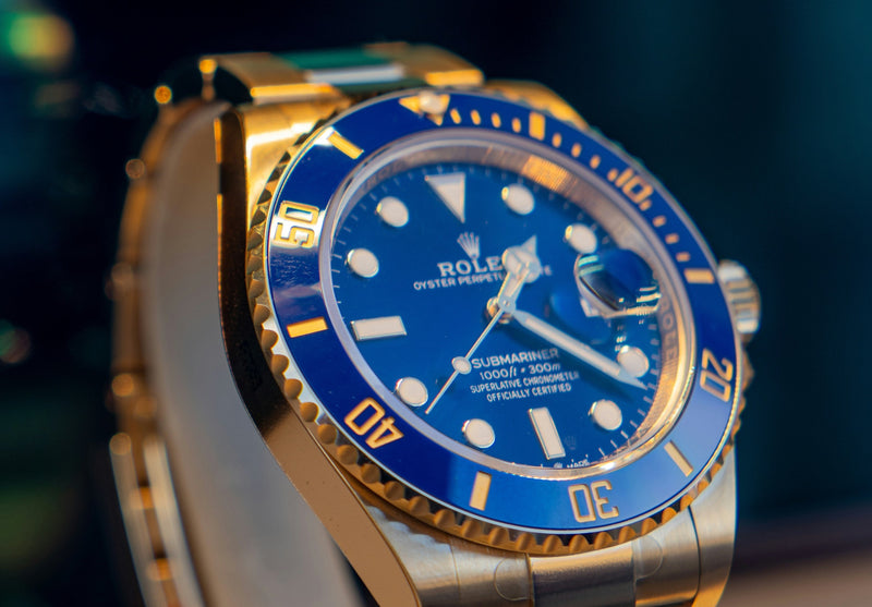 close up shot of a blue Rolex Submariner